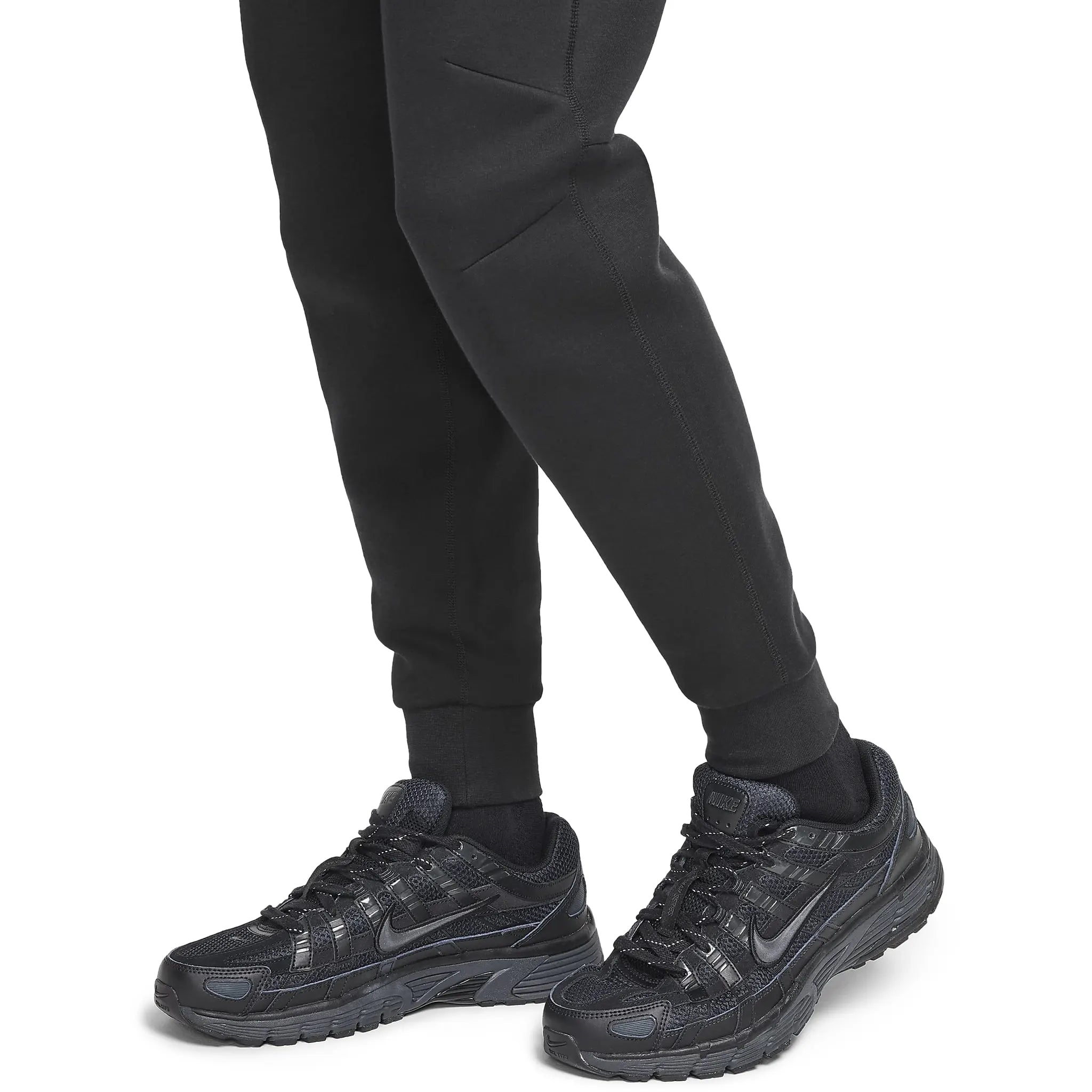 Model cuff view of Syna World x Nike Central Cee Tech Fleece Black Tracksuit HQ3748-010 | HQ3749-010
